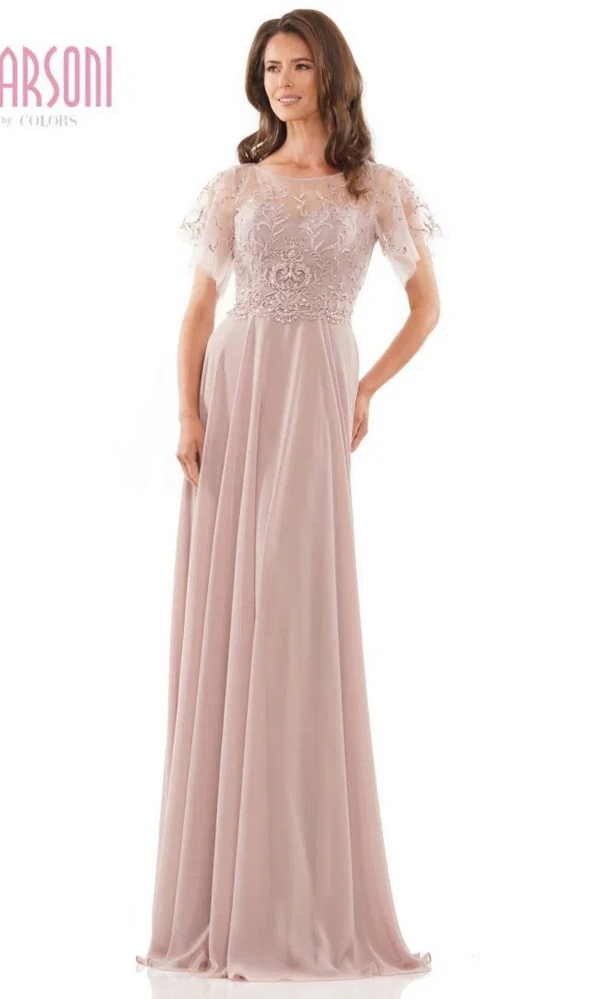 A woman in the Marsoni M323 long formal dress, featuring mauve chiffon fabric, a floral beaded bodice, and short sheer sleeves, stands against a plain white background.